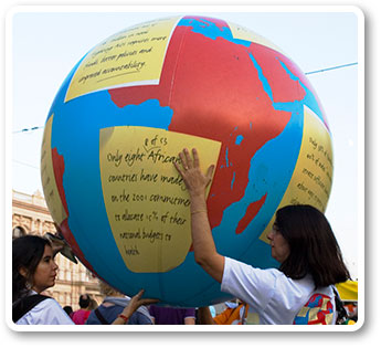 A globe is passed during the march for human rights.