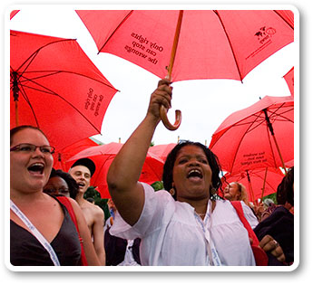Raising red umbrellas, protesters call for rights for sex workers.