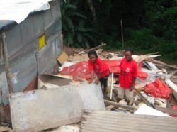 Abahlali organizers and sisters Nellie and Nosipho Mtshali amid the wreckage of a shack demolished by the city of Durban, South Africa, in the Arnett Drive settlement on January 17, 2008 (photo courtesy of Abahlali baseMjondolo).