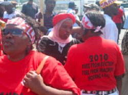 The Abahlali T-shirts read, '2010: Free from Eviction, Free from Shackfire, Housing 4 All.' 2010 refers to the year many demolitions are expected in anticipation of the World Cup being held in Durban. Fires are a primary concern for the shack dwellers, without electricity, stoves, or running water in their homes (photo by Mnikelo and Richard, courtesy of Abahlali baseMjondolo).