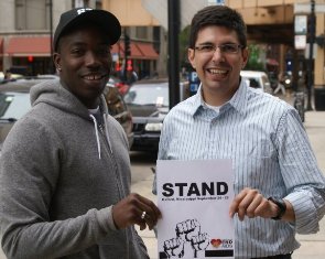 Wallace (with AIDS Foundation of Chicago's David Munar) of the Stand Against AIDS