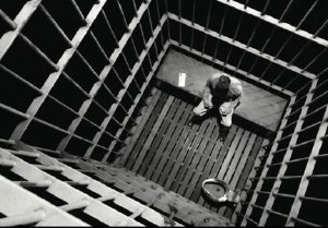 A positive test in two states condemns prisoners to isolation and a 23-hour lockdown.