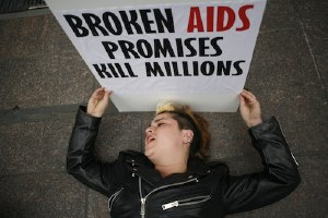 An activist 'dies' in front of the German mission.