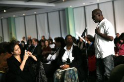 Leroy Rose, an HIV+ Medicaid user, addresses the reform team.