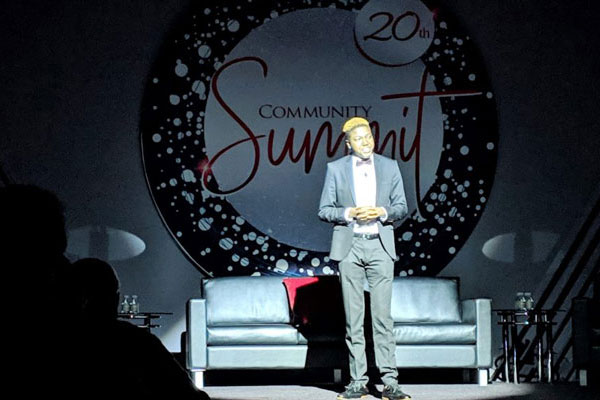 Mary Bowman performing at the opening of the 20th Anniversary Community Summit