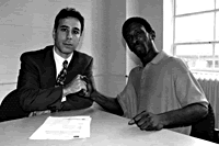 Aren Merjian, senior staff attorney for Housing Works (left) and Derrick Hanna, DASIS client filing lawsuit.