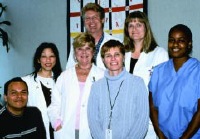 Staff at the Center for Clinical AIDS Research and Education at UCLA work with patients and perform research for clinical trials. From left, Michael Marcial; Ann Johiro, F.N.P.; Judy Carden, R.N.; Steven Miles, M.D.; Margrit Carlson, M.D. and Stevon Washington (photo by Paul Antico).