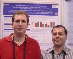 Jesse Raffa, M.Sc., and Harout Tossonian, M.D., and their poster on hepatotoxicity in injection drug users and non-injection drug users.