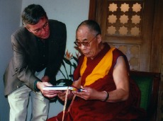 'A Closer Walk' Director, Robert Bilheimer presenting His Holiness The Dalai Lama with Edward Steichen's 'The Family of Man' following their interview in New Delhi, November 15, 2001