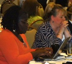 Dr. Linda Clark and clinical learning leaders developing their HIV Training Plan and discussing barriers and solutions to integrating HIV into primary care at their health center.