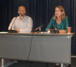 Co-chair Dr. Diane Havlir (right) explains the highlights of the conference with Joseph Elias, Global Village Coordinator.