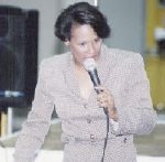 Rae Lewis-Thornton with microphone