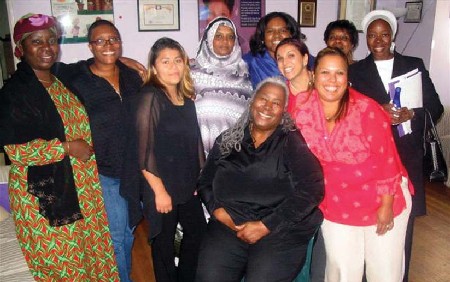 Women from various AIDS Service Organizations in Africa visit the Women Alive house.