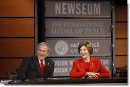 President George W. Bush and Mrs. Laura Bush react during a question and answer session Monday, Dec. 1, 2008, at the Saddleback Civil Forum on Global Health at the Newseum in Washington, D.C. White House photo by Eric Draper